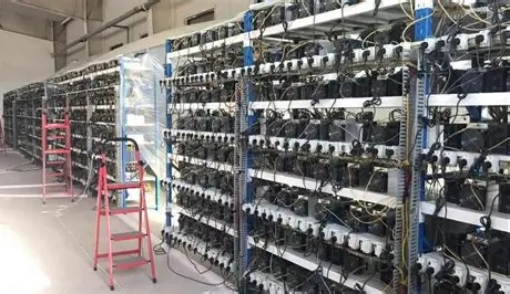 A view of a large mining farm with numerous mining rigs operating inside, highlighting the potential for scalable hosting in Wyoming.