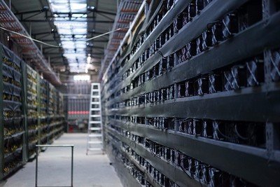 Large-scale mining farm with rows of ASIC miners